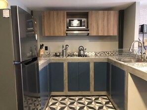 Fridge, microwave, stovetop, coffee/tea maker