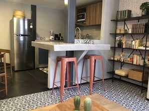 Fridge, microwave, stovetop, coffee/tea maker