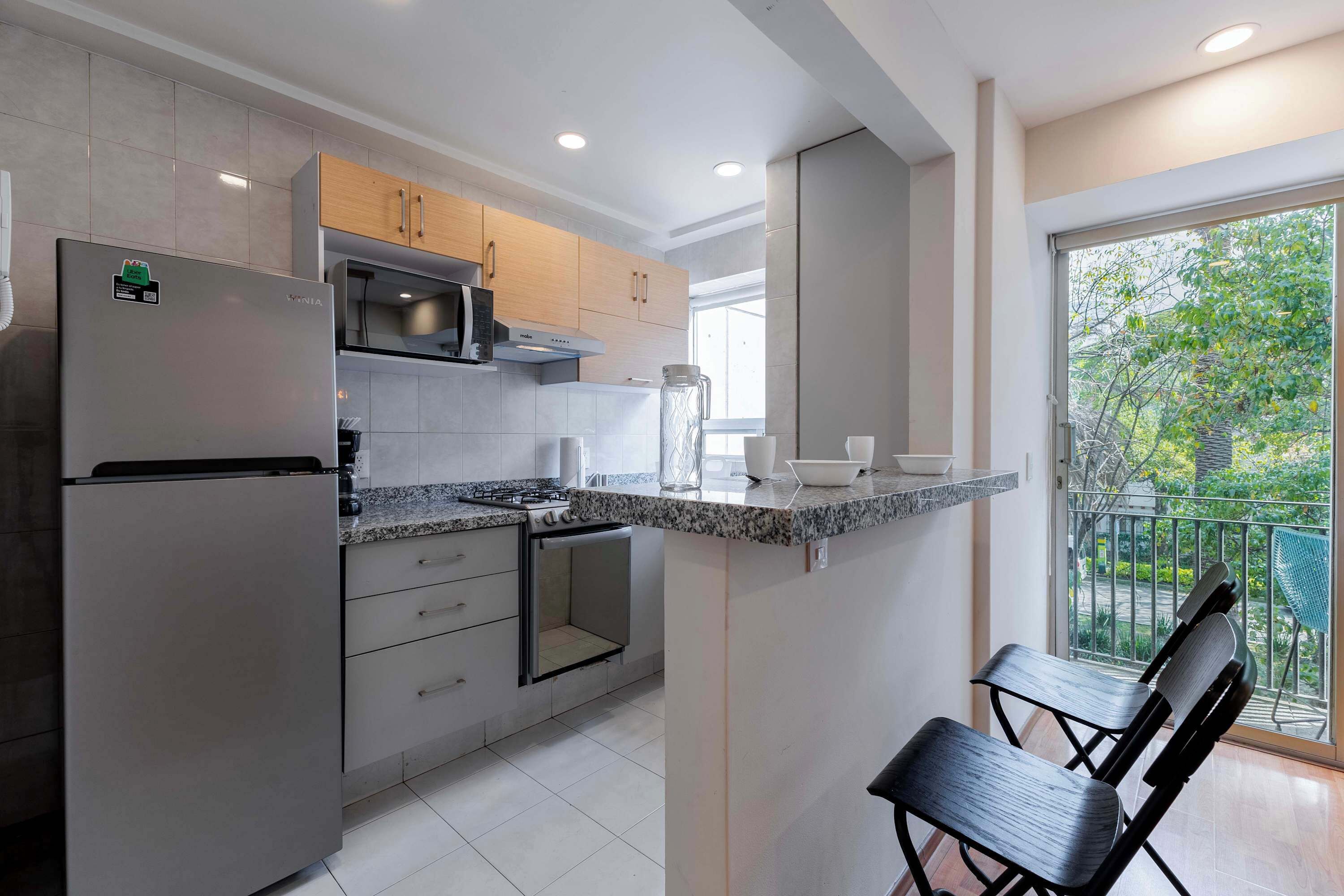 Coffee/tea maker, fridge, microwave, oven