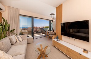 Apartment | Living area | 81-cm flat-screen TV with cable channels, TV