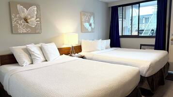 Room, 2 Queen Beds | 1 bedroom, laptop workspace, free WiFi, bed sheets