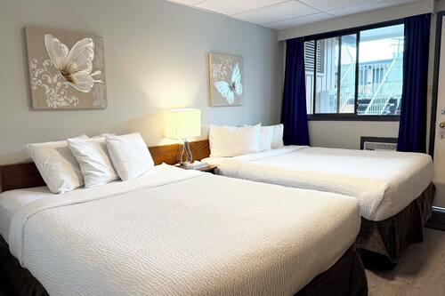 Classic Two Queen Room | 1 bedroom, laptop workspace, free WiFi, bed sheets
