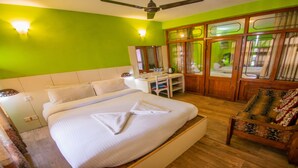 A hotel room with a bed, a desk, a chair, and a wardrobe. - MeroStay 180 Hotel EMO (Kathmandu)