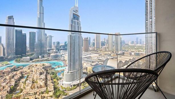 A balcony with a view of a cityscape including the Burj Khalifa and other high-rise buildings. - Silkhaus Burj Royale, Downtown Dubai (Dubai)