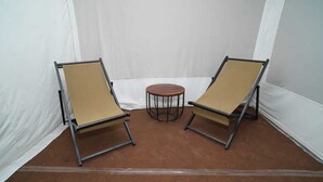 Two lounge chairs with a small round table in a tent-like structure. - Kotri Resort (Jaisalmer)