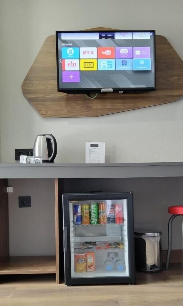 Roupas de cama premium, edredons de pluma, frigobar, cofres nos quartos