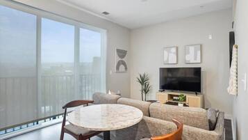 Apartment | Living area | 42-inch Smart TV with digital channels, Netflix, Hulu