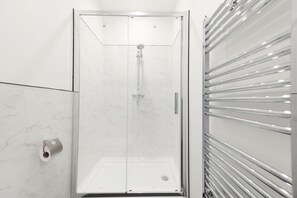 Shower, rainfall showerhead, towels