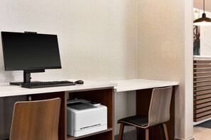 Work in comfort with a desk, keyboard, and printer at your fingertips.