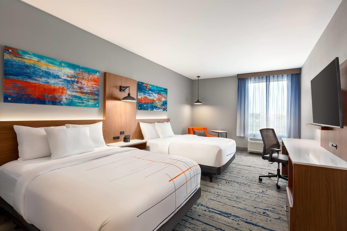 Suite, 2 Queen Beds, Non Smoking (Mobility, Hearing, Roll-In Shwr) | In-room safe, laptop workspace, free cribs/infant beds, free WiFi