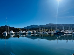 A marina with boats docked, calm water, and mountains in the background. - 2-Room Apartment in Argelès, Terrace and Parking (Argelès-sur-Mer)