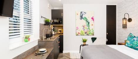 1 bedroom, desk, iron/ironing board, travel crib