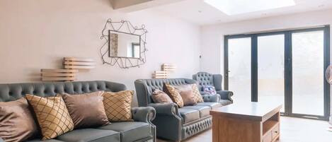 Basic House, Multiple Beds | Living area | TV