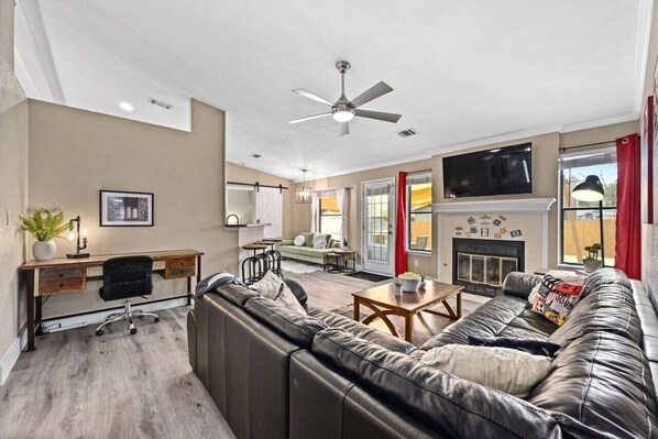 Smart TV, fireplace, books, offices