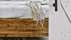 A bedroom with a wooden headboard, white bedding, a ceiling fan, and a framed artwork on the wall. - `Saloma Place` Pet-Friendly! Large yard! Work Space! (Austin)