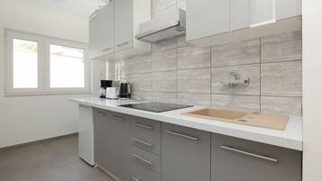 Fridge, stovetop, coffee/tea maker, cookware/dishes/utensils