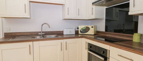 Fridge, electric kettle, toaster, cookware/dishes/utensils