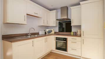 Fridge, electric kettle, toaster, cookware/dishes/utensils