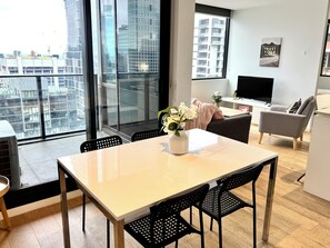 Premier Apartment | Living area | 42-inch LED TV with cable channels, TV