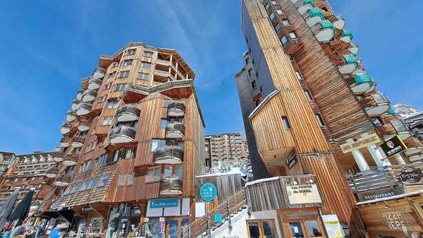 A hotel with a wooden facade, multiple balconies, and a sign for 'my little corner' restaurant. - Renovated apartment for 8 in Avoriaz, mountain charm and modern (Avoriaz)