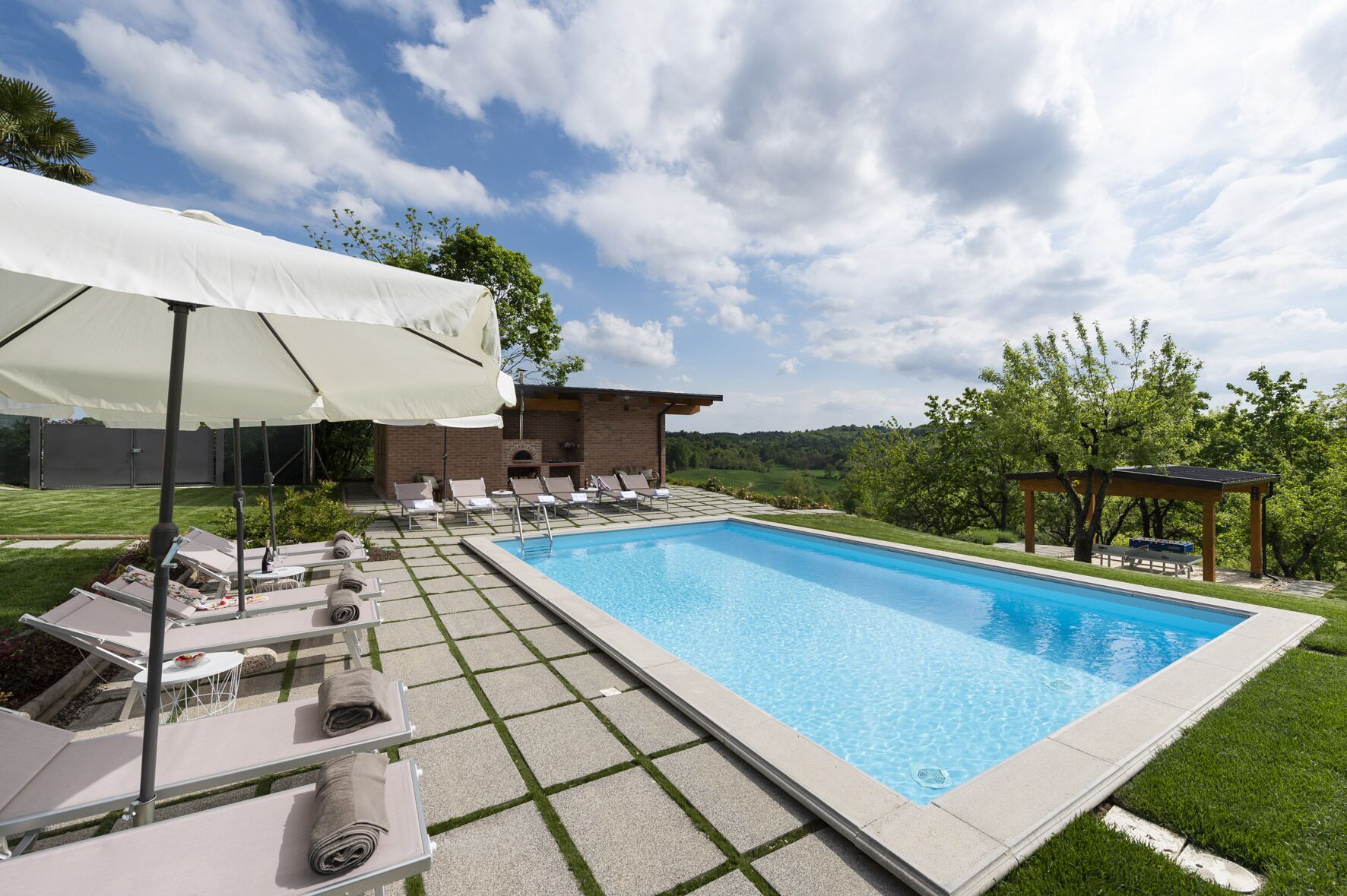 Seasonal outdoor pool, pool umbrellas, pool loungers