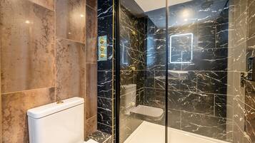 Bathtub, hair dryer, towels