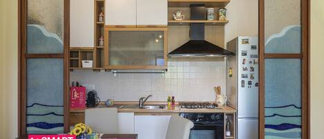 Fridge, oven, electric kettle, cookware/dishes/utensils