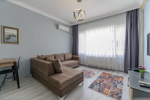 Deluxe-Suite, 1 Schlafzimmer | Wohnbereich