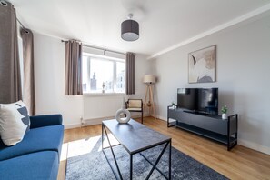 Appartement | Coin séjour | Télévision à écran plat de 37 pouces avec chaînes par câble, télévision