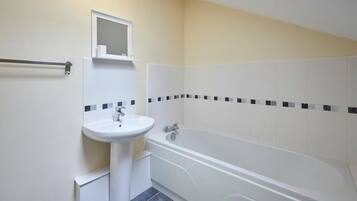 Bathtub, towels, soap, shampoo