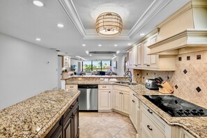 Fridge, coffee/tea maker, cookware/dishes/utensils, dining tables - Beachfront Condo -Gulf and Bay A205 (Siesta Key)