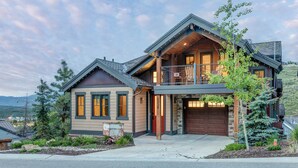 A two-story house with a garage, a balcony, and a mountain view. - 1138 Skiers Heaven! Luxury Home Close To Park City Mountain! Two Hot Tubs & Gorgeous Outdoor Space! 6 Bedroom Home by RedAwning (Park City)