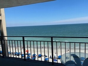 A balcony with a view of the beach and ocean. - 510 Surfmaster 2 Bedroom Condo by RedAwning (Murrells Inlet)