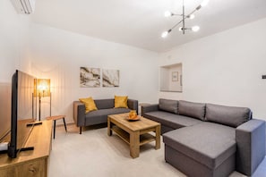Basic Apartment, Multiple Beds | Living area