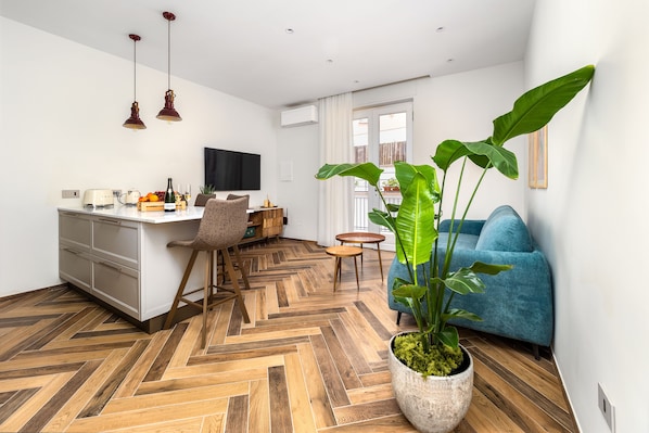 Exclusive Apartment | Living area | 50-inch flat-screen TV with digital channels, TV