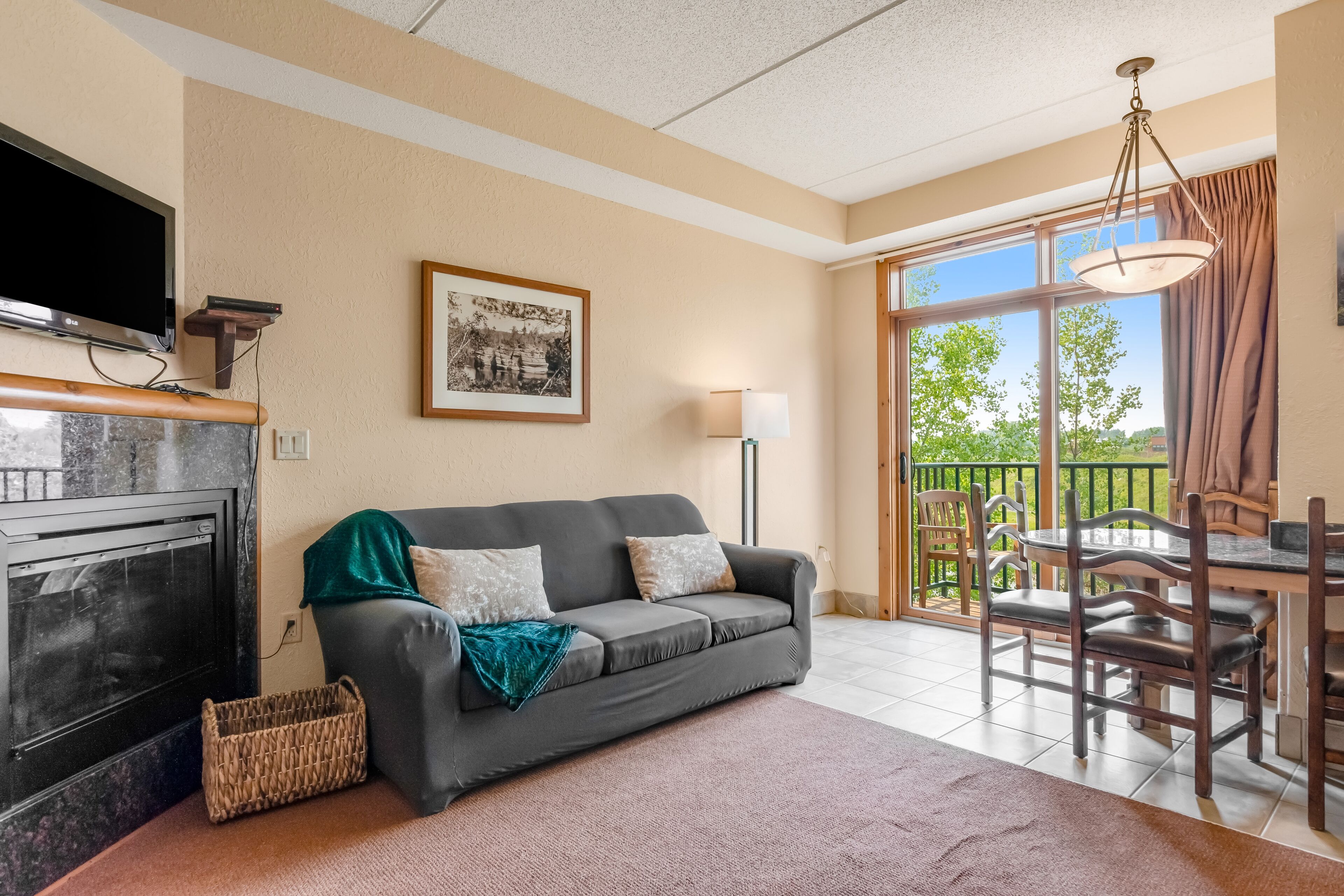 Centrally located condo with balcony, fireplace, and AC - water views