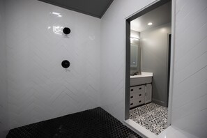 Shower, hair dryer, towels, toilet paper