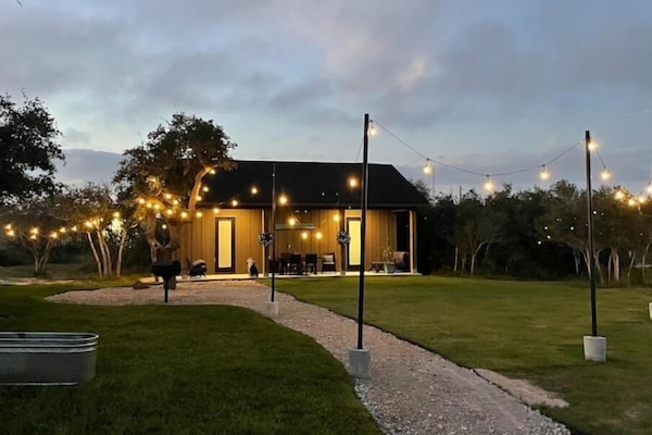 Evenings are wonderful on the large covered porch. Have a relaxing BBQ & games.