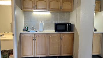 Fridge, microwave, stovetop, coffee/tea maker