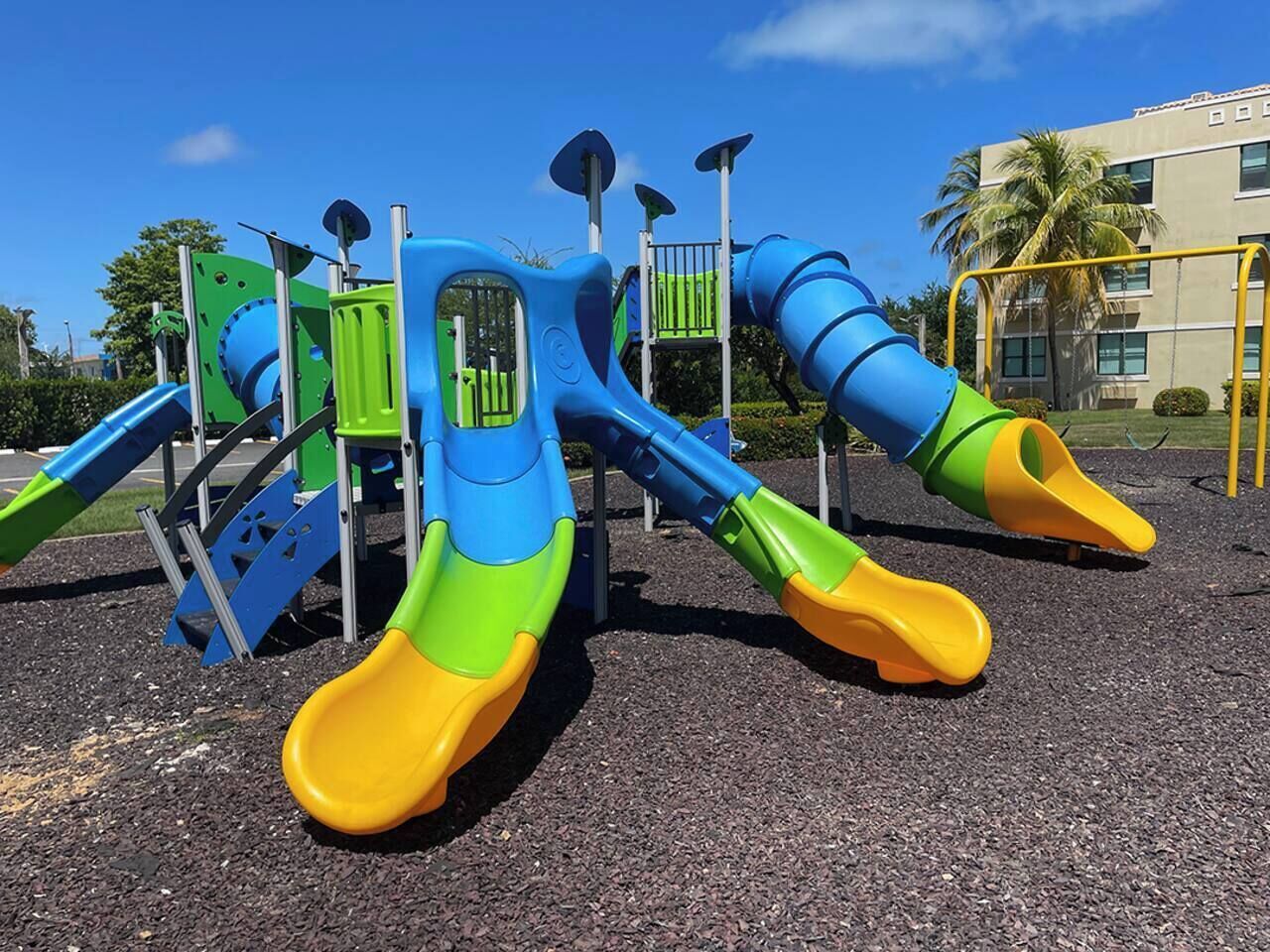 A playground with slides and climbing structures.