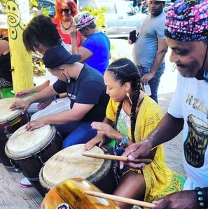 A group of people playing drums outdoors. - Tropical Getaway, Direct Beach Access, 5-Pools (Loiza PR)