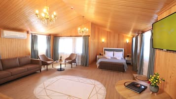 Honeymoon Room | Living area | 32-inch LCD TV with satellite channels
