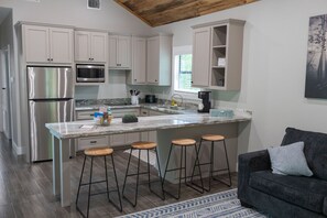 Microwave, oven, coffee/tea maker, cookware/dishes/utensils