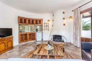 TV - Holiday apartment Oasis on the upper floor with comfort and charm, pool, and a prime location close to the beach in Cala Santanyí  (Santanyi)