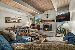 Smart TV, fireplace, books, stereo