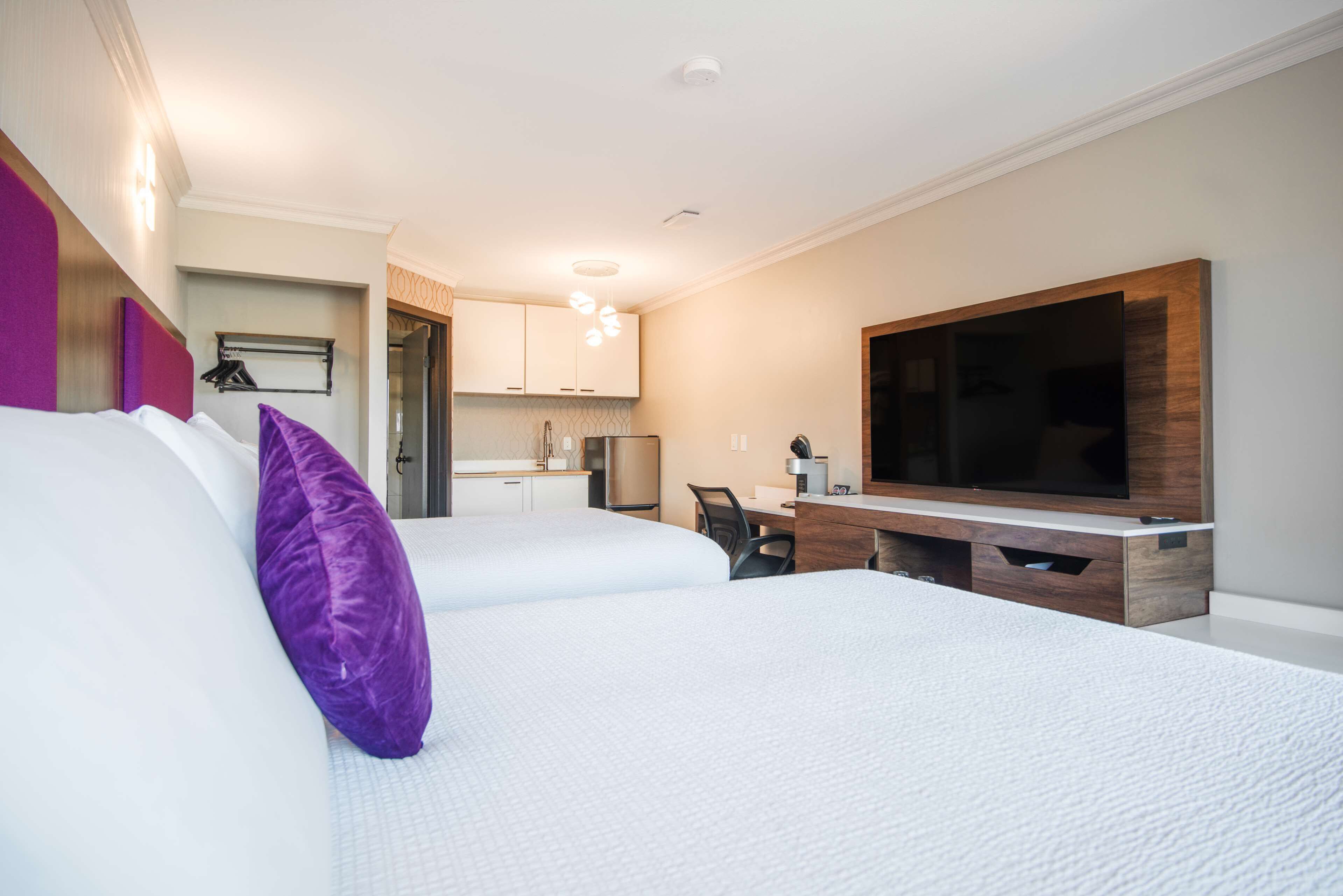 room, 2 queen beds, kitchenette | 1 bedroom, desk, laptop workspace, blackout curtains