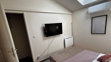 1 bedroom, desk, iron/ironing board, travel crib