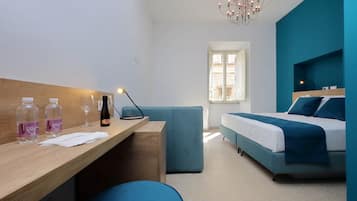 Deluxe Triple Room | Down duvets, minibar, in-room safe, iron/ironing board