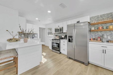 Fridge, microwave, oven, stovetop. Charming 3BR Florida Bungalow Near Beach in FWB