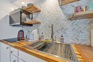 Fridge, microwave, stovetop, coffee/tea maker